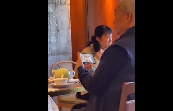 You Wont Believe What This Man Was Watching On His Cell Phone While Out Eating Brunch With His Wife