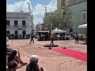 Why Is There A Stripper In High Hell Boots And A Thong With A Stripper Pole And A Red Carpet In The Middle Of Main Street?