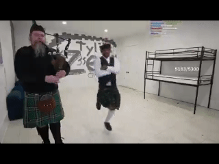 Well This Is A First. A Man Playing His Bagpipe With His Backup Dancer.