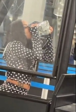 Drink Up! Woman Tries To Finish Drinking Her Open Bottle Of Patron Before Getting Through The TSA Checkpoint!